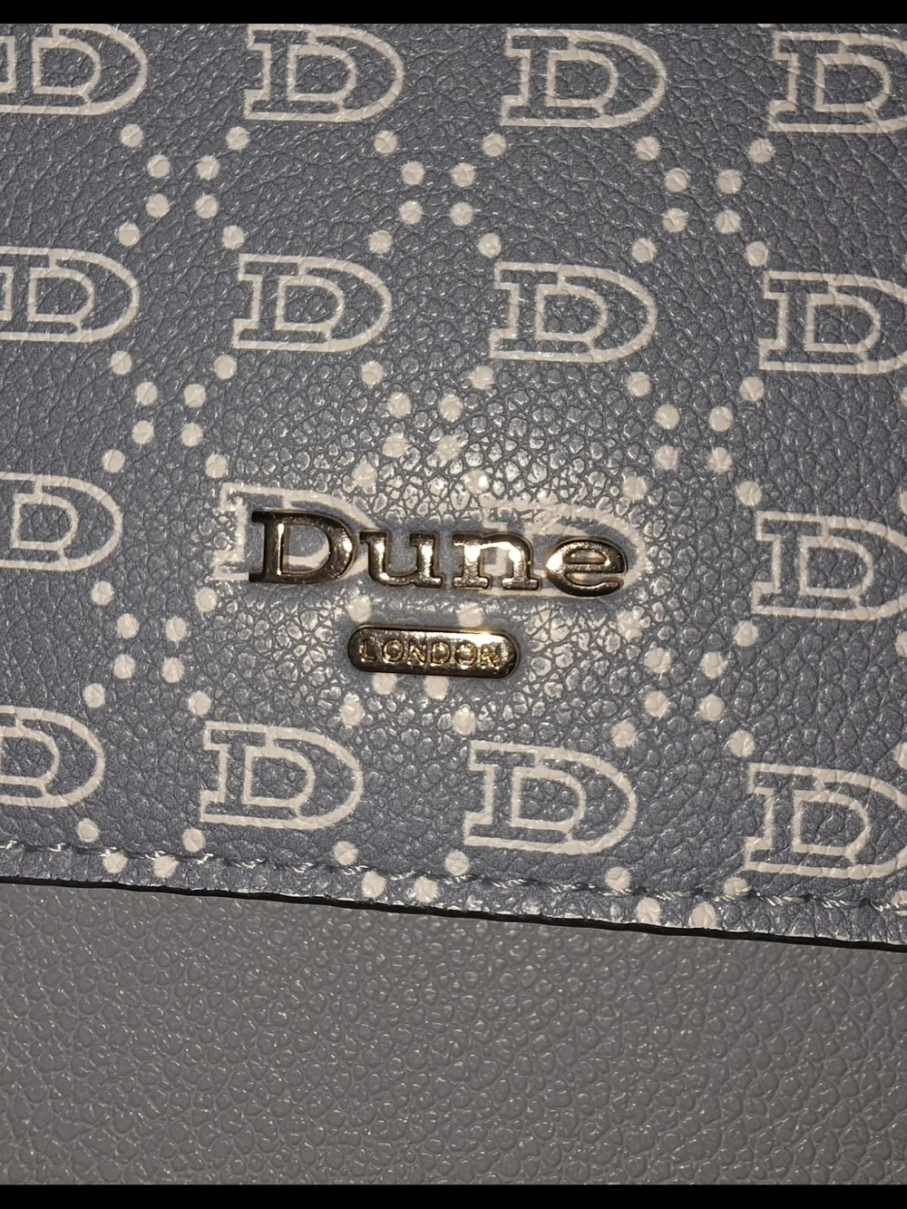Dune London two-tone flapover crossbody bag and matching wallet set.